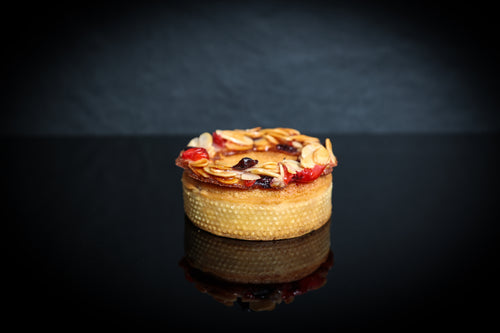 Small dessert with nuts and dried fruits on a dark background