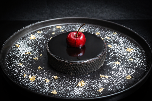 Dark choc cherry tarte on a plate